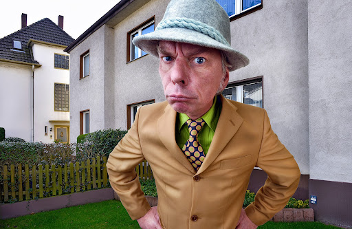 man in suit standing | new hoa management