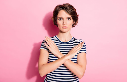 woman with crossed hands | political yard signs